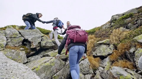 Group of hikers on a mountain. Stock Footage 82426688