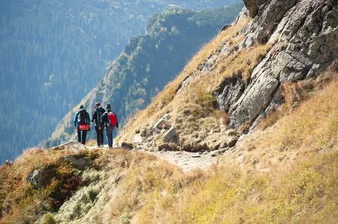 Group of Hikers on a Mountain Path Stock Photos