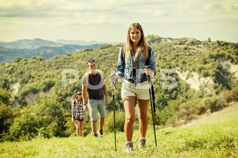 Group of hikers in the mountain in single file Stock Photos