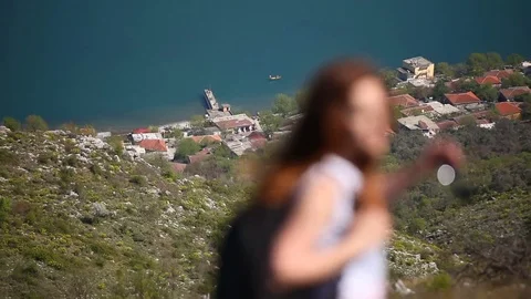Group of hikers passing by the cliff Stock Footage 79794541