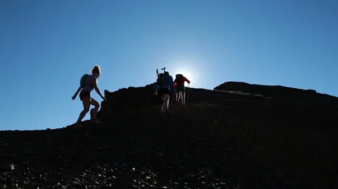 Group of hikers summit high mountain peak Stock Footage 40703896
