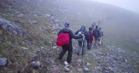 Group of hikers walking on a mountain Video stock 132301850