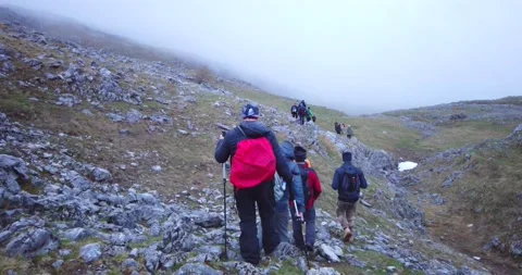 Group of hikers walking on a mountain Video stock 132303841