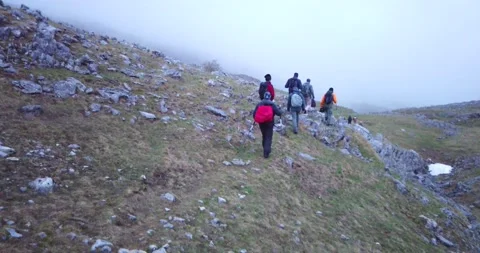 Group of hikers walking on a mountain Video stock 132303900