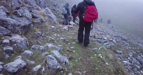 Group of hikers walking on a mountain Video stock 132303933
