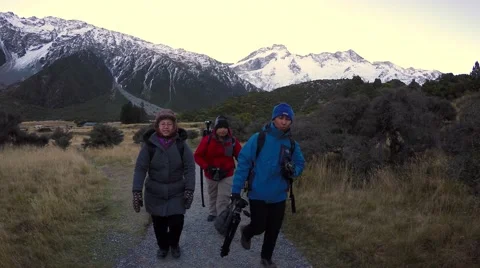 Group Hiking At Hooker Valley Track In Afternoon, Passing Camera Video stock 55757470