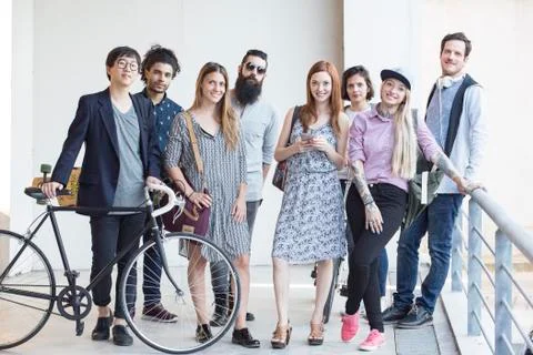 Group of hip professionals standing together outdoors Stock Photos