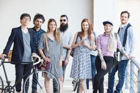 Group of hipsters standing together outdoors Stock Photos