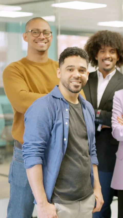 Group of hispanic colleagues smiling at camera in a coworking space Stock Footage 267553880