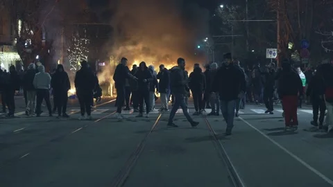 A group of hooligans set fire at night on a boulevard in Sofia Stock Footage 324555993