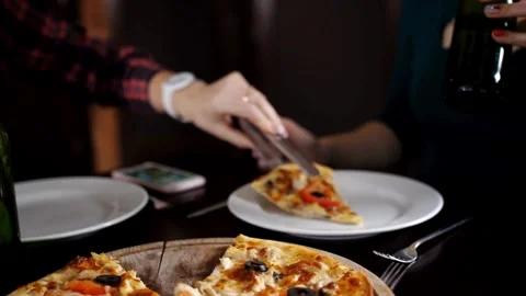 Group of hungry friends sharing delicious lunch eating ordered pepperoni pizza. Stock Footage 336586704