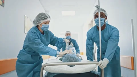 Group of hurrying paramedic multi-race doctors start to run in hospital corridor 스톡 동영상 143680680