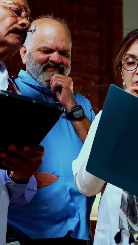 Group of indian doctors and surgeons discussing case in hispital while standing Stock Footage 342803834