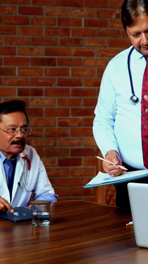 Group of indian doctors and surgeons discussing case in hispital while standing Stock Footage 342803846