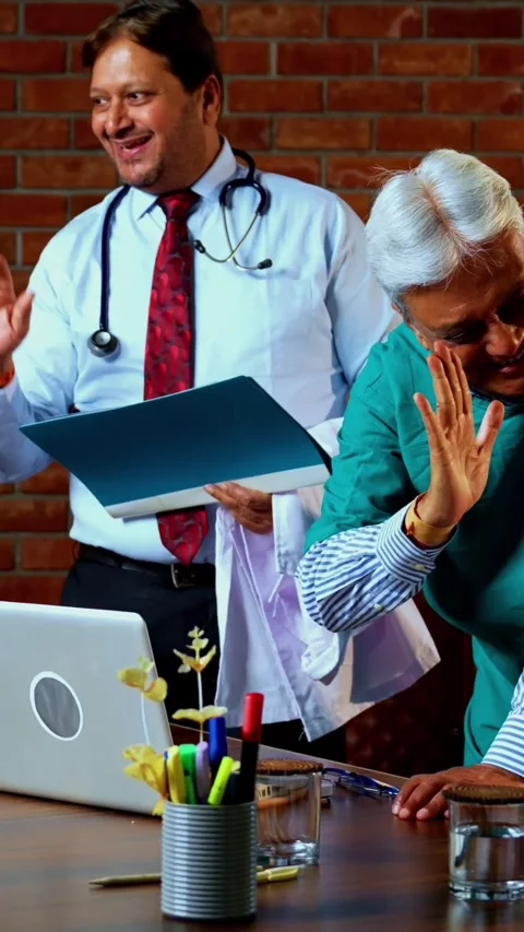 Group of indian doctors and surgeons discussing case in hispital while standing Stock Footage 342803847
