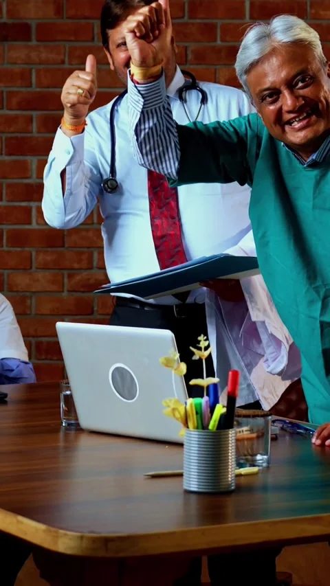 Group of indian doctors and surgeons discussing case in hispital while standing Stock Footage 342803853