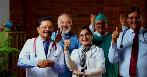 Group of indian doctors and surgeons discussing case in hispital while standing Stock Footage 342806491