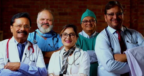 Group of indian doctors and surgeons discussing case in hispital while standing Stock Footage 342806501