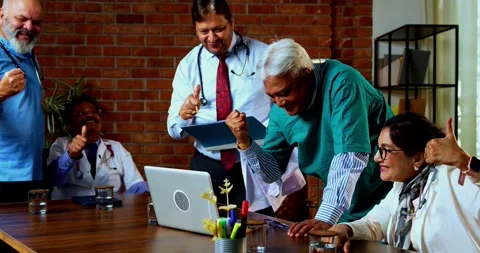 Group of indian doctors and surgeons discussing case in hispital while standing Stock Footage 342806545
