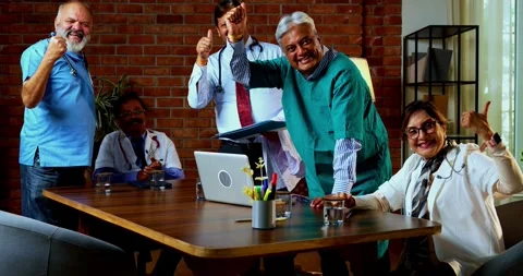 Group of indian doctors and surgeons discussing case in hispital while standing Stock Footage 342806548