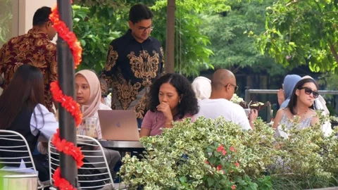 Group of indonesian worker having lunch in the restaurant Stock Footage 238081229