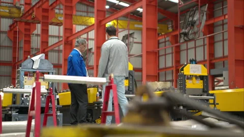 Group of Industrial worker inspecting inside a large metal tube Stock Footage 317901211