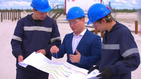 Group of industrial workers in a refinery Stock Footage 113790899