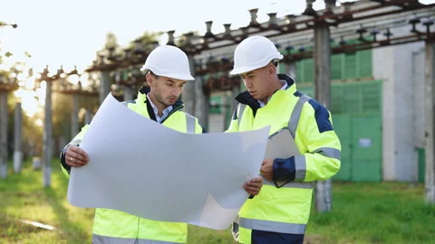 Group of Industry Engineer discussion with Blueprints checking information and Video stock 194621600
