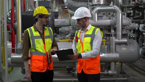 Group of Industry Engineer discussion with clipboard checking information and 스톡 동영상 154283524