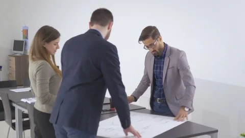 Group of intelligent young employees collaborating on a project Stock Footage 73992865
