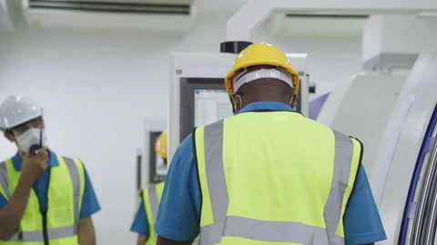 Group of interracial worker wearing face mask in production factory. Stock Footage 147910985