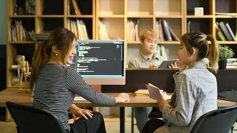 Group of IT developer working on new project together in creative office Stock Photos