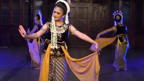 A group of Javanese dancers performs a traditional dance in front of the king Stock Footage 237486504