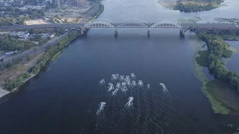 Group of jet skis rushes along the Dnieper with the flags of Ukraine. Stock Footage 171473053