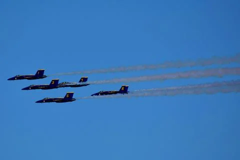 A Group Of Jets Flying In Formation Stock Photos