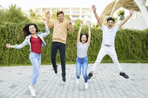 Group of joyful jumping young people Stock Photos