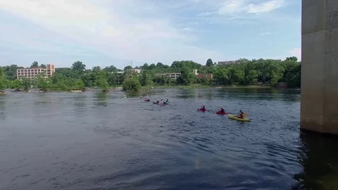 Group of kayakers crossing river Stock Footage 76944957