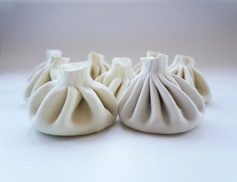 Group of khinkali on light background. Stock Photos