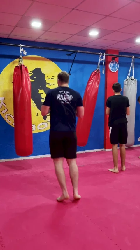 Group Kickboxing Class Training in Corfu Greece Gym Athletes Punching and Stock Footage 338421843