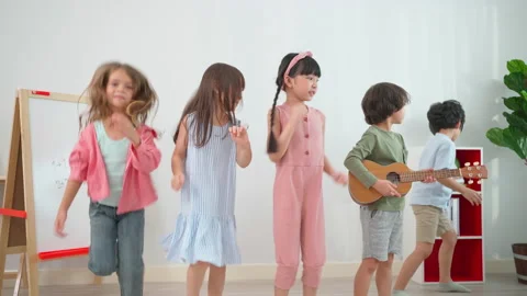 A group of kid dancing in the classroom Stock Footage 188810104