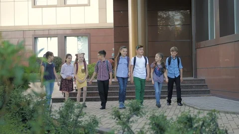 Group of kids going back from school together Stock Footage 108598471