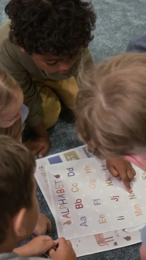 Group of Kids Learning Alphabet with Interactive Cards Stock Footage 295016632