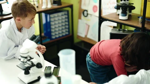 Group of kids students using microscope ... | Stock Video | Pond5