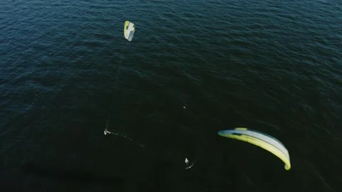 Group of kite surfers doing tricks in the Baltic Sea at sunset, Gdansk, Poland. Stock Footage 262551644