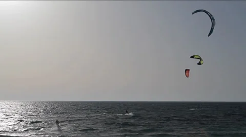 Group of kite surfers riding in open sea Stock Footage 26000906