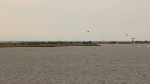 A group of kitesurfers in training Stock Footage 145899081
