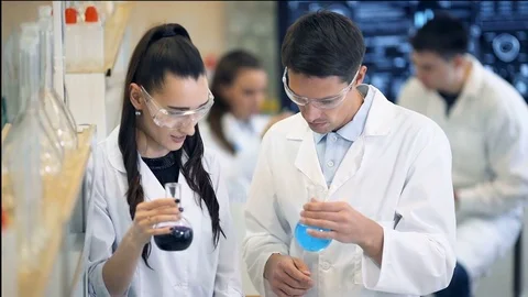 Group of laboratory scientists discussing their research at the lab Video stock 74937629