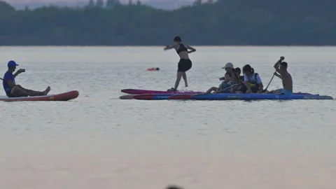 Group on Large Paddleboard with Many People Stock-Footage 345041162