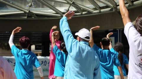 Group learning qigong practice in Vancouver downtown Stock Footage 51771438