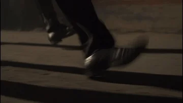 Group of legs/shoes walking through a steam cloud in dark alley Stock Footage 85488066